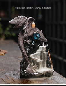Detailed close-up of a dragon sculpture backflow incense burner with smooth purple sand texture