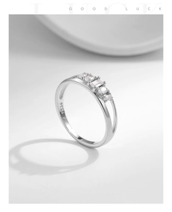 Macro shot of S925 hallmark on minimalist silver ring with five sparkling cubic zirconia