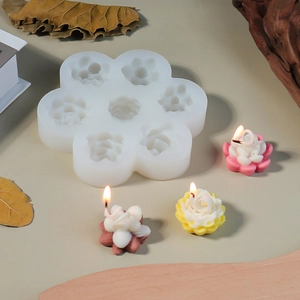 Detail of 7-cavity silicone mold showing lotus shaped candles and realistic textures