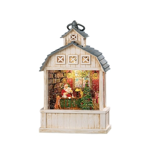 Lanterne musicale de Noël avec scène du Père Noël dans un cadre maison blanche
