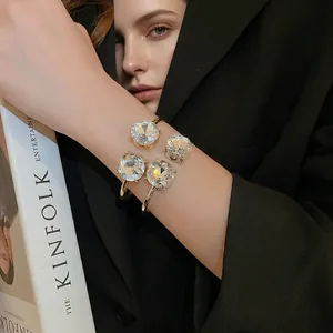 Elegant gold-plated open cuff bracelet featuring four large round faceted crystals for women