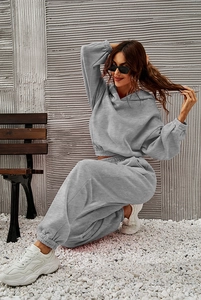 Detail of light gray two-piece tracksuit with cropped hoodie and drawstring sweatpants