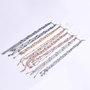 Detail of 1.5mm ball bead chains in gold, silver and rose gold with card packaging