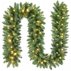 Detail of 9ft green pine needle Christmas garland with warm white LED lights