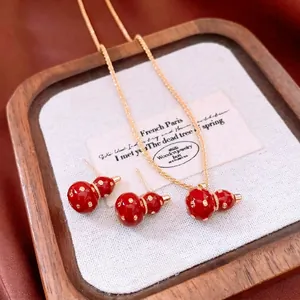 Exquisite 18k gold plated Wu Lou necklace and earring jewelry set with red accents