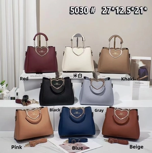 Close-up of heart-shaped metal clasp and 8 colors of leather handbags for women