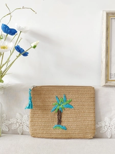 Beige woven paper braid clutch with tropical blue and green embroidered coconut trees
