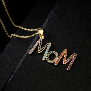 18K gold plated MOM necklace with colorful micro-set zircons on a dark background