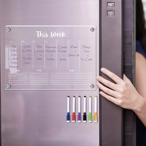Macro view of clear magnetic acrylic weekly planner for fridge with 6 colored markers