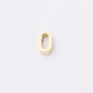 Macro detail of high-polished golden stainless steel oval pendant connector for DIY jewelry