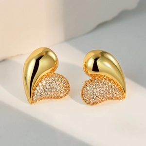 Elegant gold heart stud earrings with half-polished finish and half-micro-paved cubic zirconia