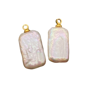 Two natural white freshwater baroque rectangular pearl pendants with gold metal loops