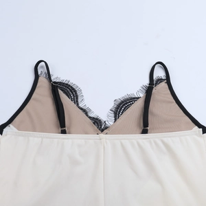 Detailed shot of lace splicing V-neckline and adjustable straps on the backless dress