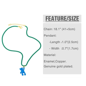 Detail of blue bear pendant necklace with green woven rope and gold-plated chain