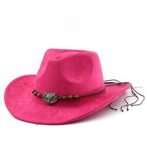 Detail of rose red cowboy hat with bull skull metal ornament and beaded leather band