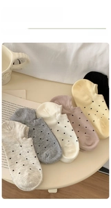 Close-up of polka dot invisible socks in multiple colors with ribbed cuffs for women