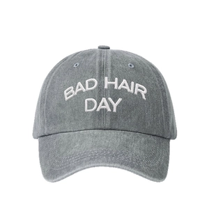Adjustable dark grey washed cotton baseball cap with white Bad Hair Day embroidery