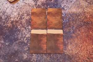 Macro view of four vintage kraft paper envelopes with antique textures and flap details
