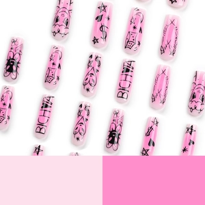 Pink gradient coffin nails featuring graffiti hearts stars and moons for a sweet cool look