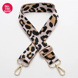 Close-up of leopard print replacement bag strap with adjustable gold lobster clasps