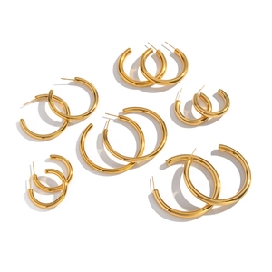 Set of minimalist 18K gold-plated C-shaped hoop earrings in various sizes on white background