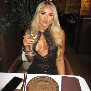 Close-up of black sheer lace detailing and deep V-neckline of a sleeveless bodysuit