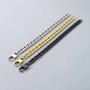Detailed view of hip hop style Cuban link bracelets in silver, gold, and black stainless steel