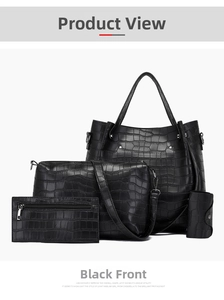 Detail view of 4-piece black crocodile embossed handbag set with silver hardware