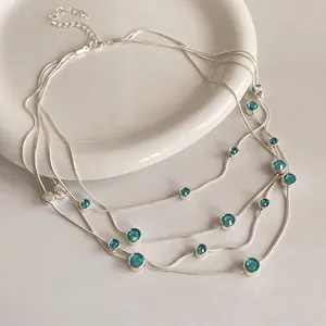 Elegant multi-layer silver snake chain necklace with round blue zircon accents