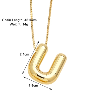 Detail view of gold balloon letter U pendant with dimensions 2.1cm and square box chain