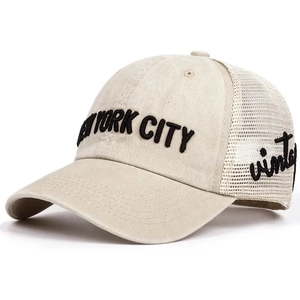Macro detail of NEW YORK CITY foam printing and vintage embroidery on mesh trucker cap