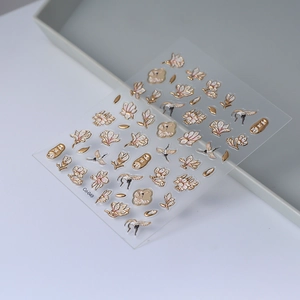 Detailed macro view of 5D embossed nail stickers featuring cranes and magnolia flowers