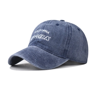 Close-up of white California Los Angeles 3D embroidery on washed cotton baseball cap