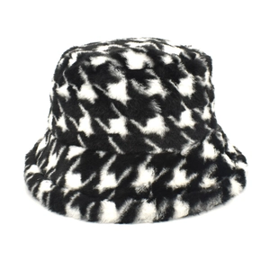 Detailed view of the plush black and white houndstooth pattern on this warm winter bucket hat