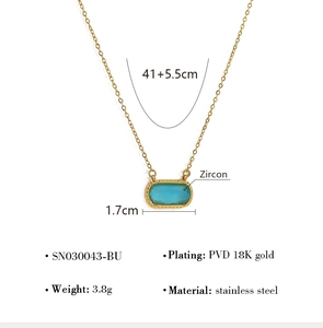 Macro view of blue rectangular zircon pendant with PVD 18K gold plated stainless steel chain