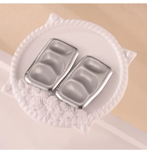 Detailed top view of a rectangular silver three-slot mixing tray with a metallic finish