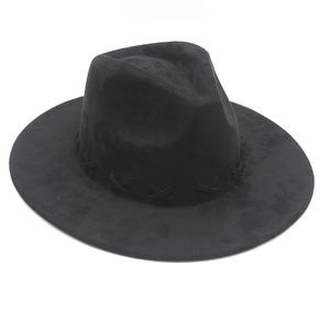 Detail of black wool fedora hat featuring a vintage cross-stitch band decoration