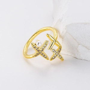 Gold open ring with double star design featuring a white pearl and paved zircons