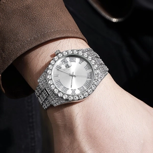 Macro detail of men's silver hip-hop watch with diamond encrusting and Roman dial