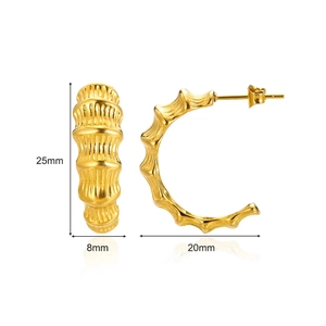 Detailed view of bamboo texture gold hoops with 25mm height and 20mm diameter measurements