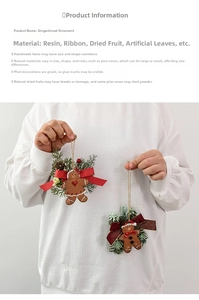 Close-up of resin gingerbread man ornament with pine cones and ribbon for Christmas trees