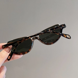 Women's semi-rimless tortoise shell cat eye sunglasses with dark UV protective lenses