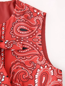 Close-up of red paisley print vest showing high-quality stitching and neck detail