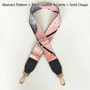 Graffiti printed wide bag strap with black leather trim and gold metal lobster clasps