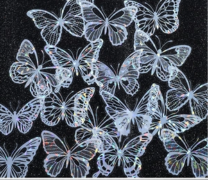 Detailed holographic laser butterfly stickers with iridescent effect on black glitter background