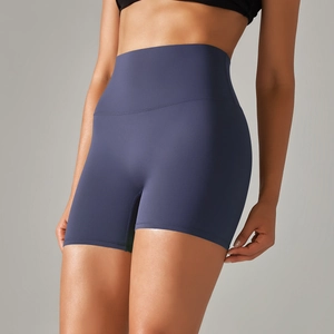 Detail of high-waist dark blue yoga shorts featuring wide tummy control waistband