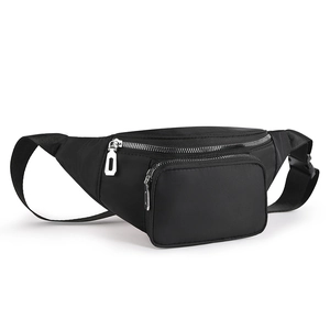 Detail view of water-resistant black nylon waist bag featuring dual silver metal zippers