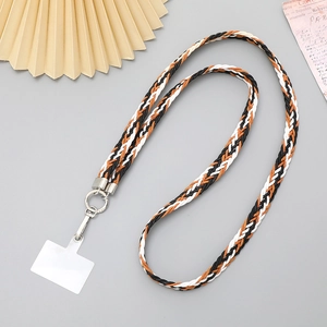 Detail of tricolor braided crossbody phone strap with silver metal clasp and connector