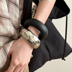 Minimalist metallic polished wide bangle and matte black thick bracelet jewelry set