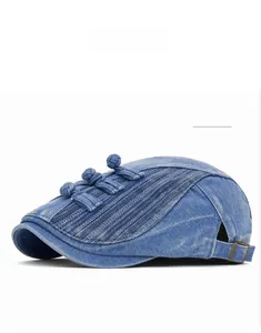 Detail view of blue washed denim flat cap featuring traditional Chinese knot buttons